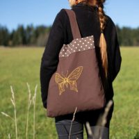 Dorothy in Catland - brown tote bag with polka dots and a yellow butterfly