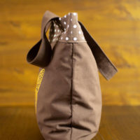 Dorothy in Catland - brown bag with white dots and a yellow butterfly