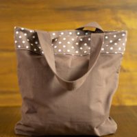 Dorothy in Catland - brown bag with white dots and a yellow butterfly