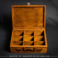 Dorothy in Catland - Tea box with compartments and red moth