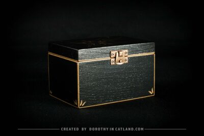 Black wooden jewellery box with a hand-painted golden flower on the lid and a golden bee inside, featuring antique bronze fittings.