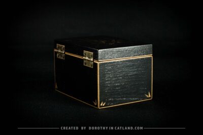 Black wooden jewellery box with a hand-painted golden flower on the lid and a golden bee inside, featuring antique bronze fittings.