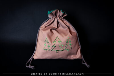 Dorothy in Catland - Brown drawstring bag with Holiday tree - Christmas trees