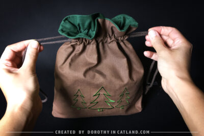 Dorothy in Catland - Brown drawstring bag with Holiday tree - Christmas trees