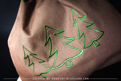 Dorothy in Catland - Brown drawstring bag with Holiday tree - Christmas trees