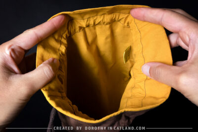 Dorothy in Catland - Brown sachet bag with a yellow butterfly