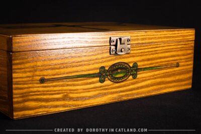 Dorothy in Catland - Tea box with green dragonfly graphic