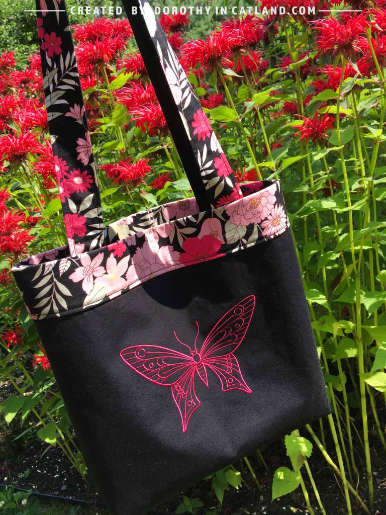 Light cotton shoulder bag with embroidered pink butterfly and floral motif