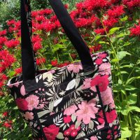 Reversible tote bag fully covered with colorful floral fabric pattern
