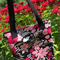 Reversible tote bag fully covered with colorful floral fabric pattern
