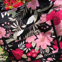 Reversible tote bag fully covered with colorful floral fabric pattern