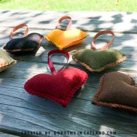 Autumn felt hearts in six colors displayed together on a flat surface